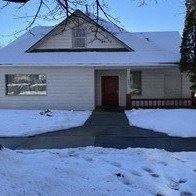 Pullman apartment for rent - the front of a house covered in snow