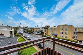 San Diego apartment for rent - the view from the balcony of an apartment building on a city street