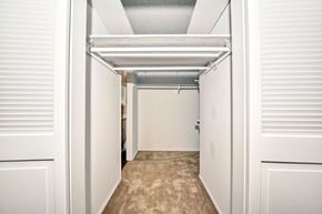 San Diego apartment for rent - a bedroom with a closet and a door to a bathroom