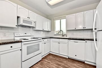 San Diego apartment for rent - a white kitchen with white appliances and white cabinets