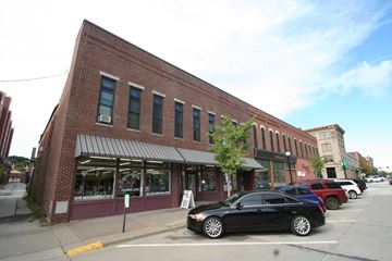 Red Wing apartment for rent - a small brick building with cars parked in front of it