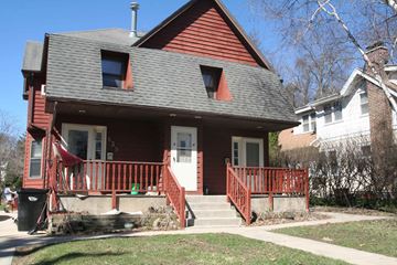 Rochester apartment for rent - a house with a red porch and a gray roof