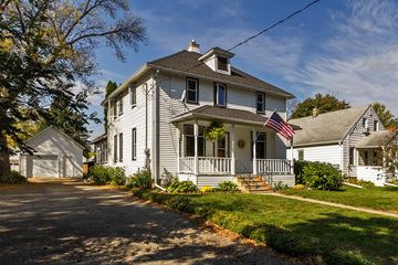 Rochester apartment for rent - a white house with an flag on the porch