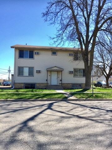 Rochester apartment for rent - a white building with a tree in front of it