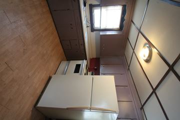 Red Wing house for rent - a view from above of a kitchen with white cabinets and a window