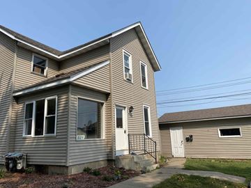 Wabasha apartment for rent - the front of a house with a white door and a driveway