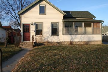 Rochester house for rent - a white house with a red door and a sidewalk
