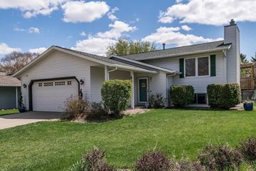 Rochester house for rent - a white house with a lawn in front of it