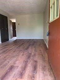 Boulder apartment for rent - A room with wooden flooring and a red wall.