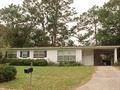 Pensacola house for rent - a house with a yard in front of it