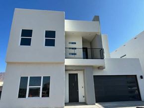 El Paso house for rent - a white house with a balcony and a black door