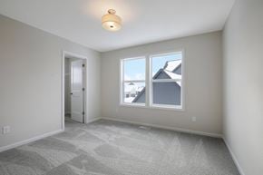 Hugo house for rent - a living room with a large window and a door