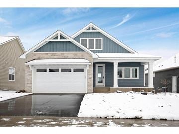 Lake Elmo house for rent - a house with a white garage door in the snow