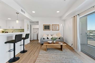 Burbank apartment for rent - A modern living room with a grey sofa and a coffee table.