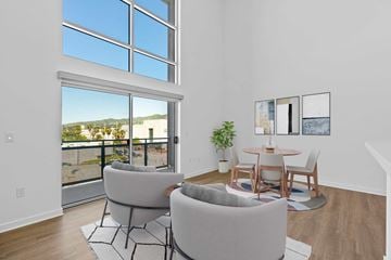 Burbank apartment for rent - A living room with a table and two chairs.