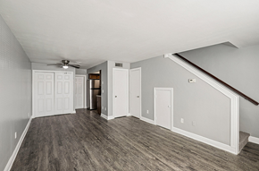 North Fort Myers apartment for rent - A room with a ceiling fan and wooden flooring.