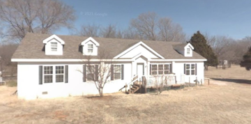 Edmond house for rent - a white house with a tree in front of it