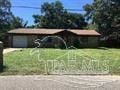 Pensacola house for rent - a house in the middle of a grass field