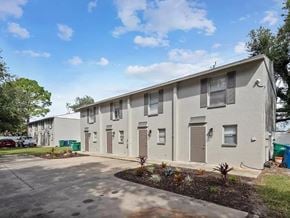 Bradenton apartment for rent - A row of houses with a clear blue sky above them.