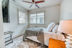 Baton Rouge apartment for rent - a bedroom with a bed and a ceiling fan