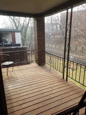 Pittsburgh apartment for rent - a screened in porch with a view of a train