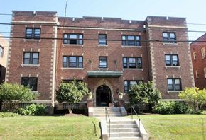 Pittsburgh apartment for rent - a large brick building with stairs in front of it