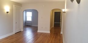 Pittsburgh apartment for rent - an empty living room with wood floors and white walls