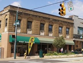 Pittsburgh apartment for rent - a building on the corner of a street with a traffic light
