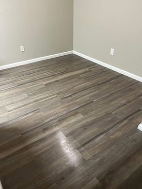Hubbard apartment for rent - A room with a wooden floor and two switches on the wall.
