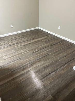 Hubbard apartment for rent - A room with a wooden floor and two switches on the wall.