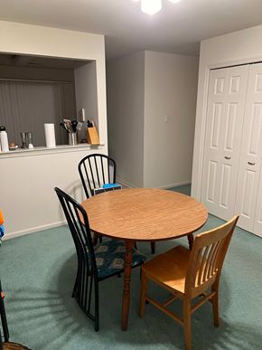 Holland apartment for rent - A dining room with a table and chairs.