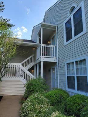 Holland house for rent - A house with a balcony and stairs leading to it.