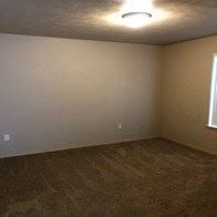 Spokane Valley apartment for rent - an empty room with white walls and a light on the ceiling