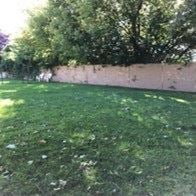 Spokane Valley apartment for rent - a yard with green grass and a fence