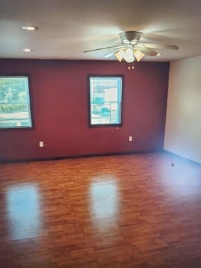 Trevose apartment for rent - A room with a ceiling fan and two windows.