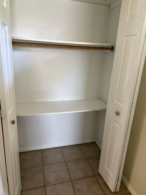 Trevose apartment for rent - A white closet with a shelf and a door.