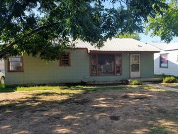 Levelland house for rent - a small white house with a tree in front of it