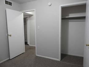 Bay City apartment for rent - A white door is open to a hallway.