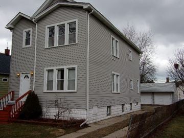 Hammond apartment for rent - a gray house with white siding and white windows