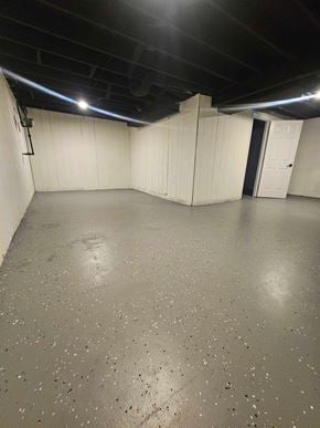 St. Louis house for rent - A spacious room with a concrete floor and white walls.