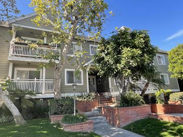 Los Angeles apartment for rent - an old house with a porch and a tree in front of it