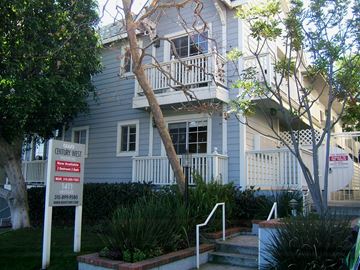 Los Angeles apartment for rent - a white house with a sign in front of it
