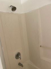 Fort Myers apartment for rent - A white bathtub with a silver faucet and shower head.