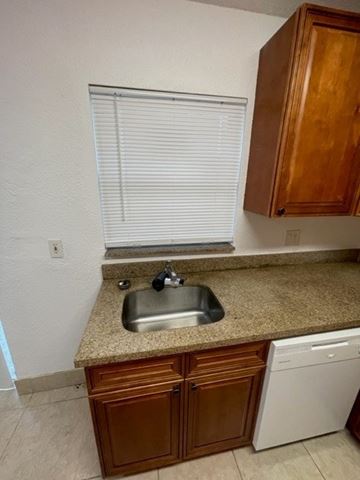Lake Worth apartment for rent - A kitchen with a sink and a dishwasher.