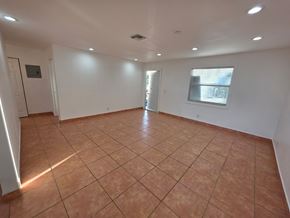 Lake Worth apartment for rent - A room with tiled flooring and white walls.