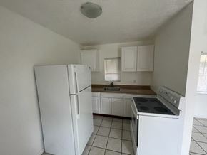 Haverhill apartment for rent - A kitchen with white appliances and cabinets.