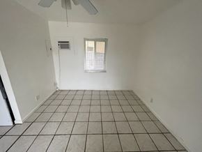 Haverhill apartment for rent - A room with a fan and a window.