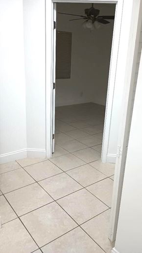 West Palm Beach apartment for rent - A room with a ceiling fan and tiled floor.