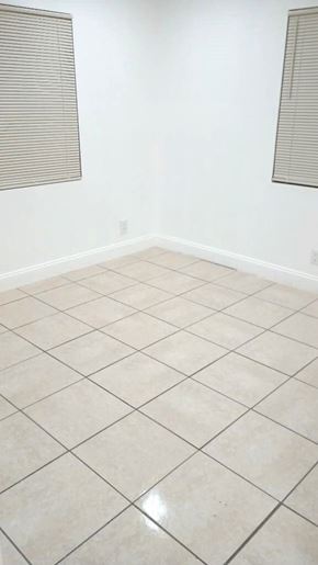 West Palm Beach apartment for rent - A room with white walls and a tiled floor.