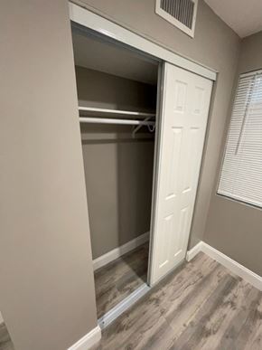 Lake Worth apartment for rent - A white door is open to a small pantry.
